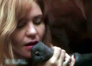 Blonde sucking horse's monstrous cock